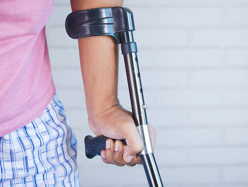 Lady with crutches needing Personal Injury Blackpool services